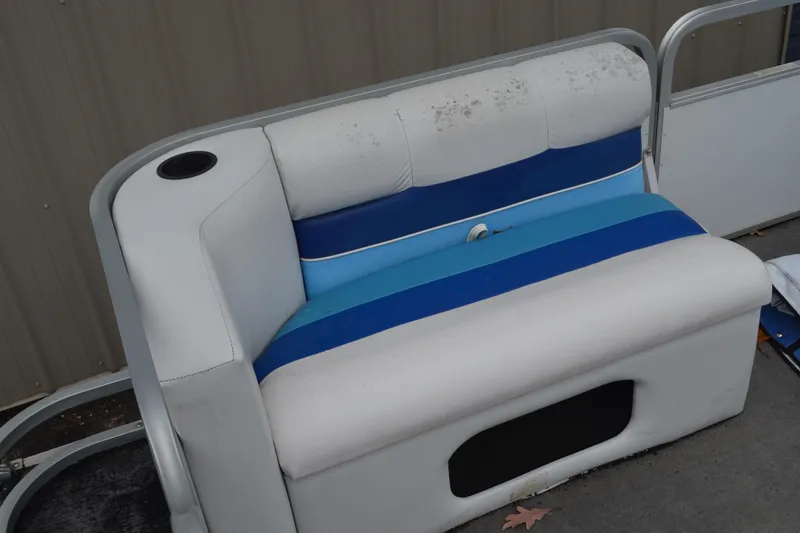 Slide: The Image of White and blue boat seat from a 1992 Manitou SPORT, featuring a cup holder. - 7