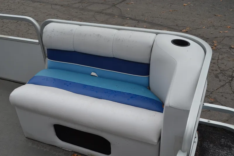 Slide: The Image of 1992 Manitou SPORT boat seat with blue and white upholstery, featuring a cup holder. - 8