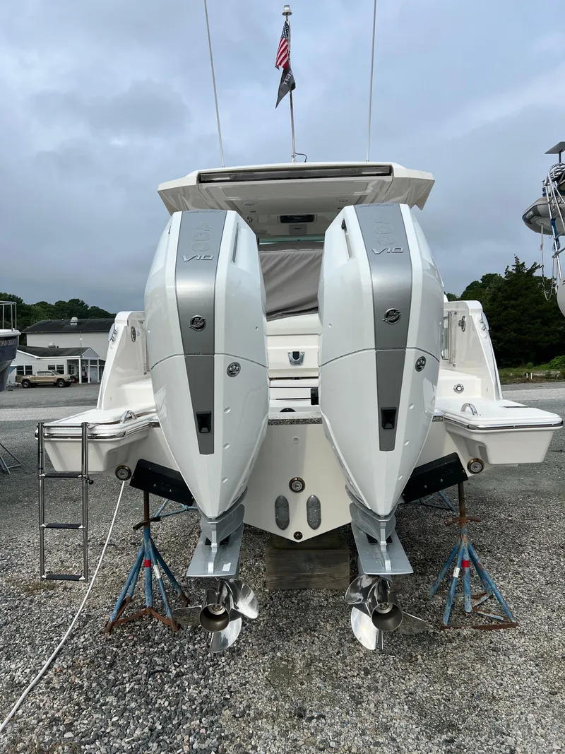 Slide: The Image of 2026 Tiara Yachts 34 LS with dual outboard engines on display. - 2