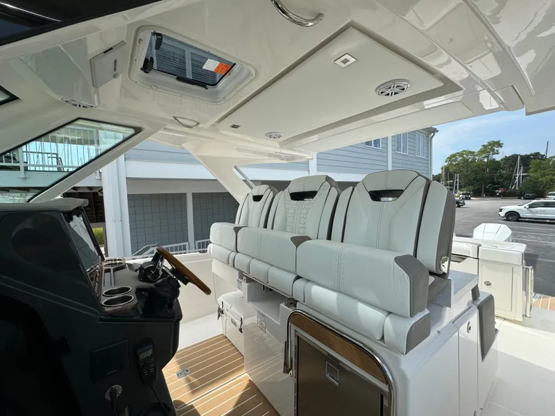 Slide: The Image of 2025 Tiara Yachts 34 LS interior with luxurious seating and modern helm design. - 3