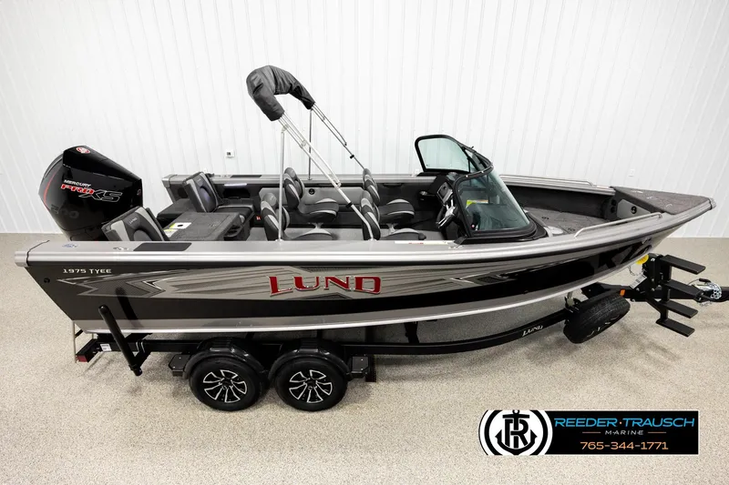 Slide: The Image of 2026 Lund 1975 Tyee fishing boat with Mercury Pro XS engine on trailer. - 1