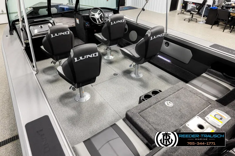 Slide: The Image of Interior of 2026 Lund 1975 Tyee boat with four swivel seats and modern dashboard. - 10