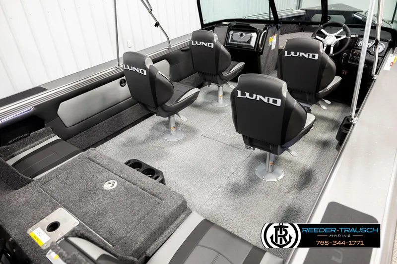 Slide: The Image of Interior of 2026 Lund 1975 Tyee boat with four swivel seats and modern dashboard. - 11