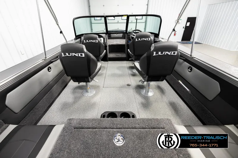 Slide: The Image of Interior of 2026 Lund 1975 Tyee boat with four seats and steering console. - 12