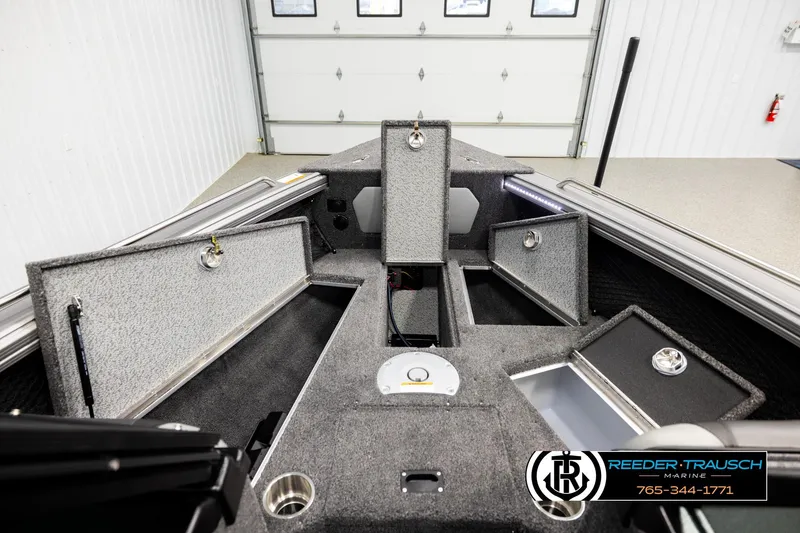 Slide: The Image of Interior view of 2026 Lund 1975 Tyee boat with open storage compartments. - 15
