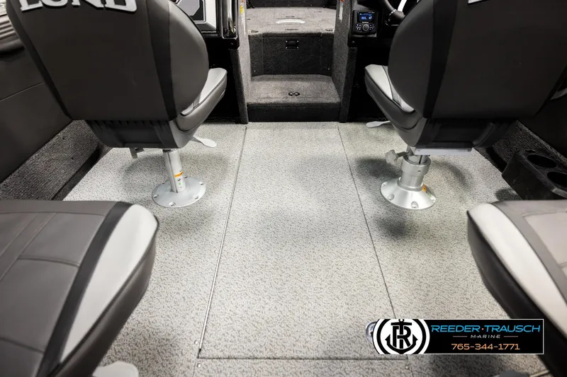 Slide: The Image of Interior of 2026 Lund 1975 Tyee boat with swivel seats and carpeted flooring. - 21