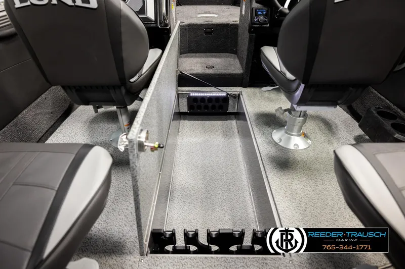 Slide: The Image of Interior of 2026 Lund 1975 Tyee boat with seating and storage compartments. - 22
