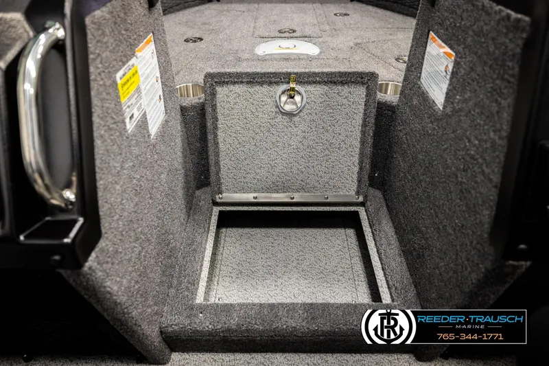 Slide: The Image of Interior of 2026 Lund 1975 Tyee boat with open storage compartment. - 24