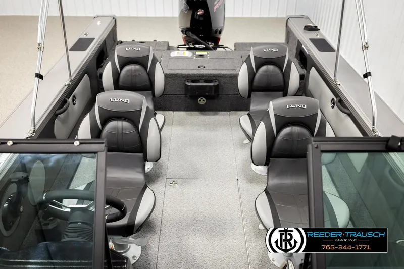 Slide: The Image of Interior of 2026 Lund 1975 Tyee boat with four black and gray seats. - 25