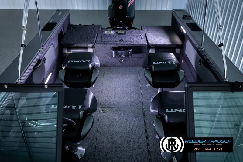 Slide: The Image of Interior of 2026 Lund 1975 Tyee boat with seating and steering console. - 27