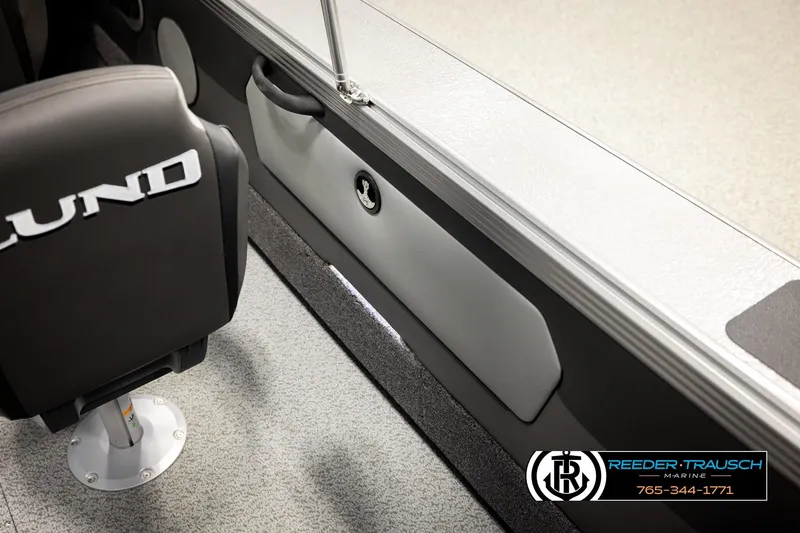 Slide: The Image of Interior of 2026 Lund 1975 Tyee boat with branded seat and storage compartment. - 31