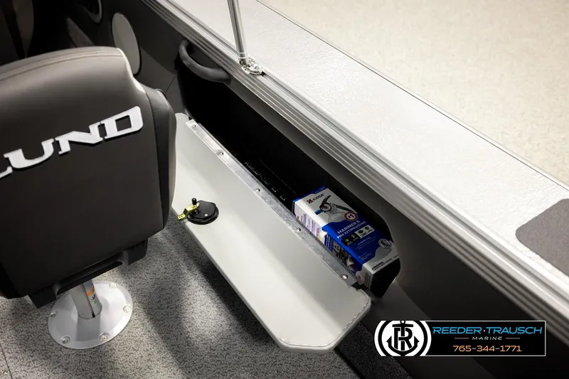 Slide: The Image of Interior of 2026 Lund 1975 Tyee boat with storage compartment and branded seat. - 32