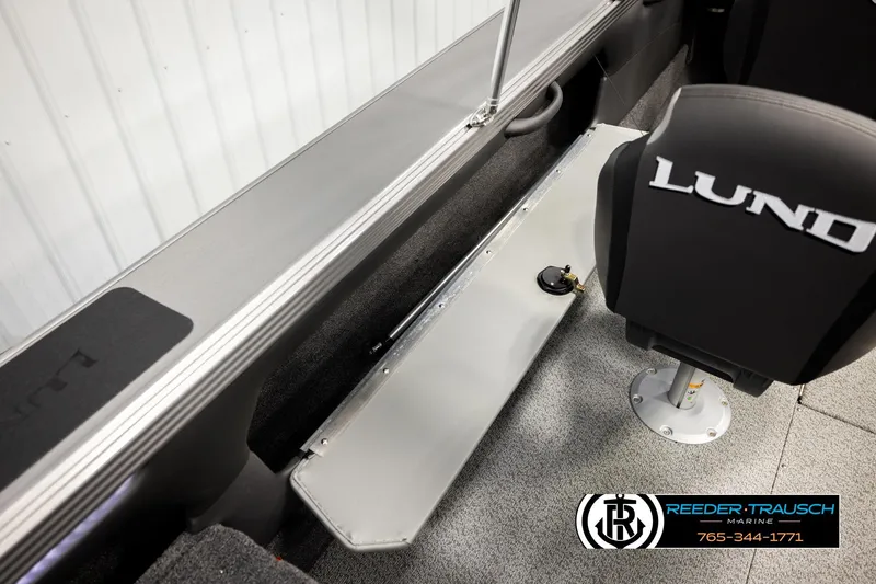 Slide: The Image of Interior of 2026 Lund 1975 Tyee boat with branded seating and carpeted flooring. - 34