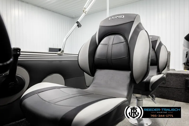 Slide: The Image of 2026 Lund 1975 Tyee boat interior with sleek black and gray seating. - 42