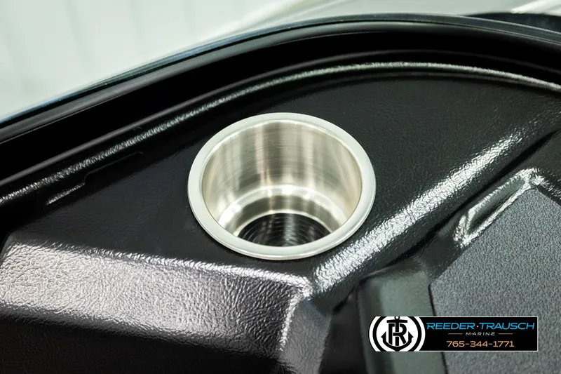 Slide: The Image of Close-up of a 2026 Lund 1975 Tyee boat cup holder, Reeder-Trausch Marine logo visible. - 46