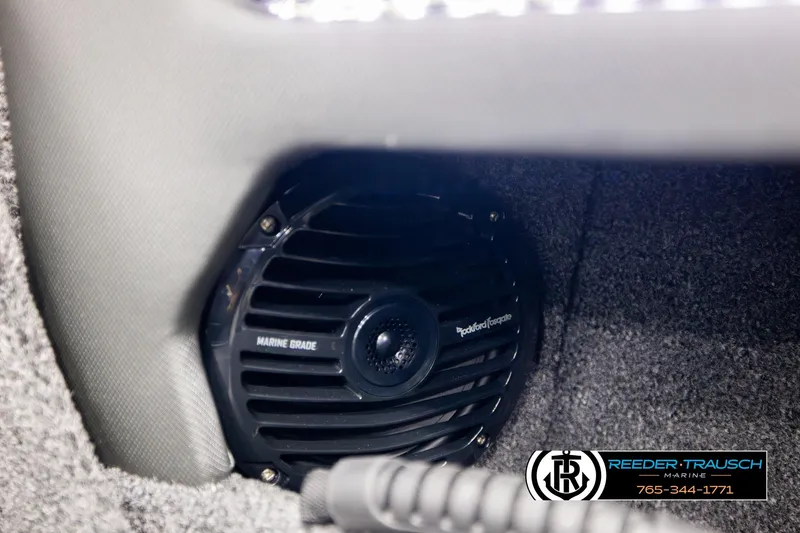 Slide: The Image of Marine-grade speaker in 2026 Lund 1975 Tyee boat interior, Reeder-Trausch Marine branding. - 47