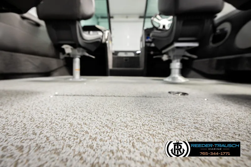 Slide: The Image of Interior of 2026 Lund 1975 Tyee boat with carpeted flooring and swivel seats. - 48