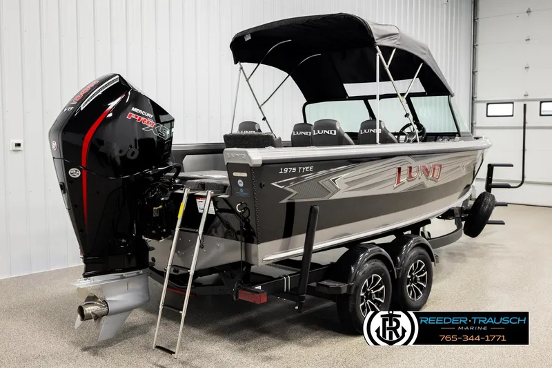 Slide: The Image of 2026 Lund 1975 Tyee boat with Mercury Pro XS engine in showroom. - 5