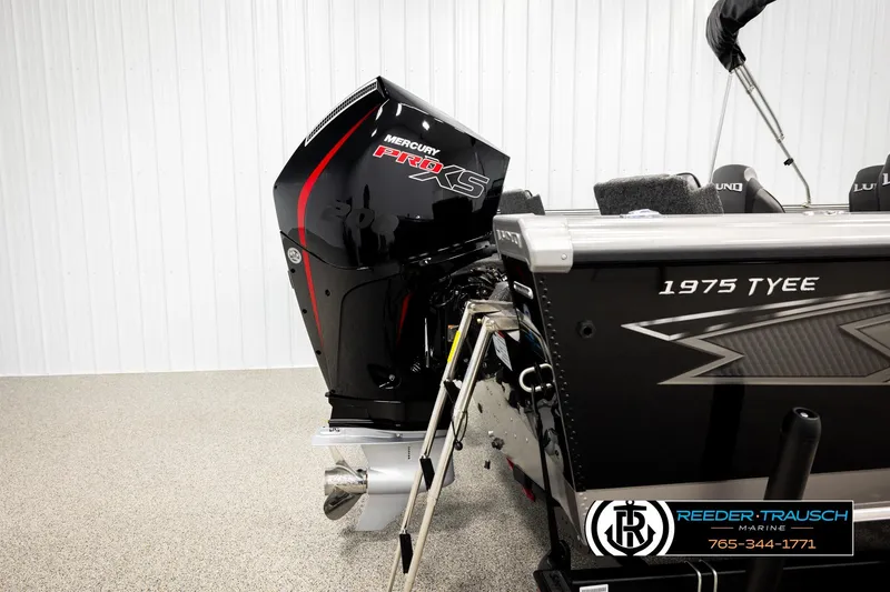 Slide: The Image of 2026 Lund 1975 Tyee boat with Mercury Pro XS engine in showroom. - 51