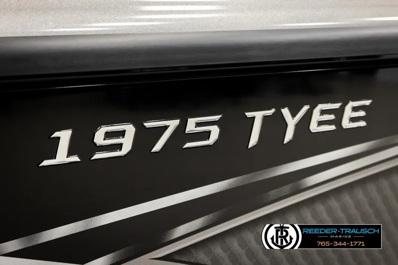 Slide: The Image of Close-up of 2026 Lund 1975 Tyee boat model name on hull. - 58