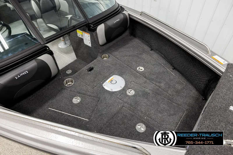 Slide: The Image of Interior of 2026 Lund 1975 Tyee boat with carpeted flooring and seating. - 8