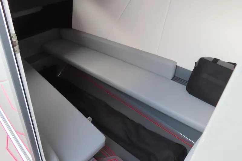 Slide: The Image of Interior cabin of 2025 Sunsation 32 CCX boat with gray seating and storage. - 11