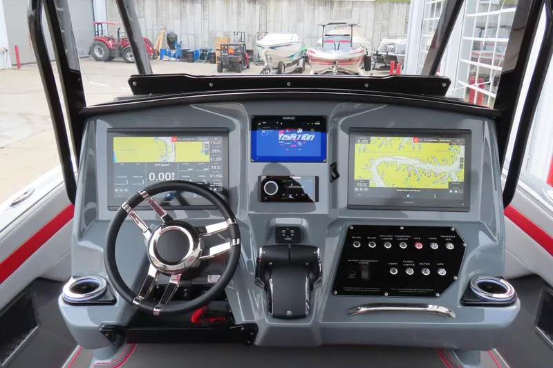 Slide: The Image of 2025 Sunsation 32 CCX boat dashboard with advanced navigation displays and controls. - 15