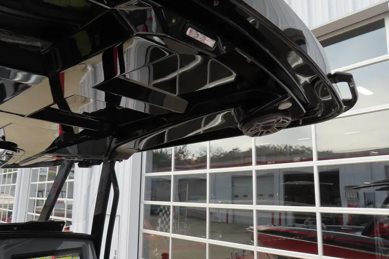 Slide: The Image of 2025 Sunsation 32 CCX boat interior with sleek black design and modern features. - 16