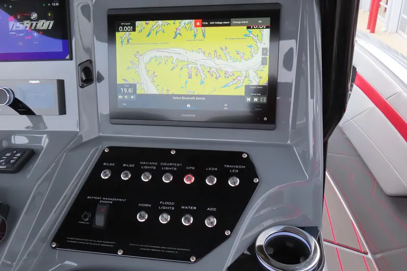 Slide: The Image of 2025 Sunsation 32 CCX boat dashboard with Garmin navigation and control panel. - 17