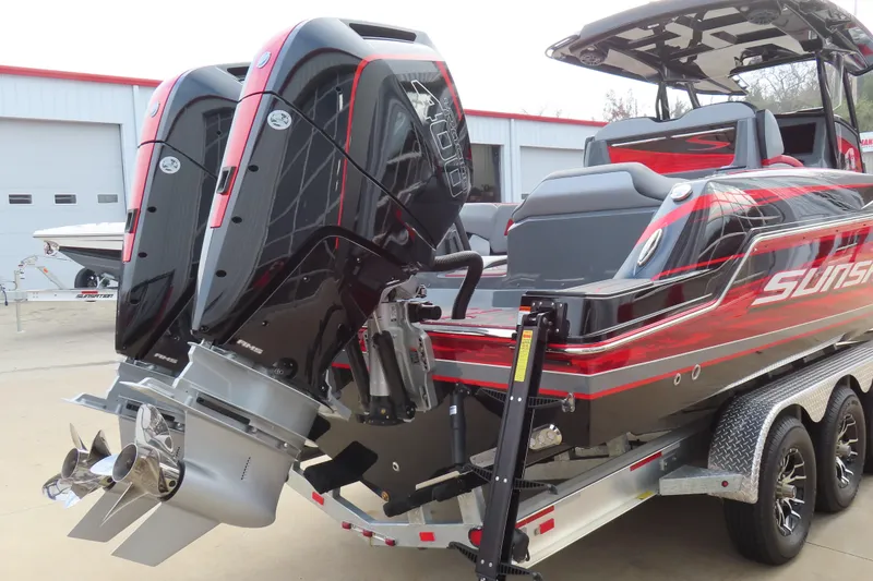 Slide: The Image of 2025 Sunsation 32 CCX boat with dual outboard engines on a trailer. - 6