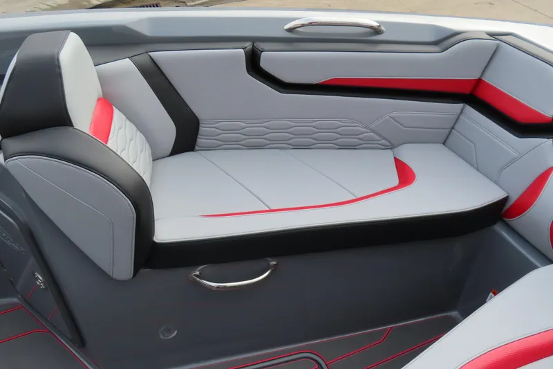 Slide: The Image of 2025 Sunsation 32 CCX boat interior with modern gray and red seating design. - 9