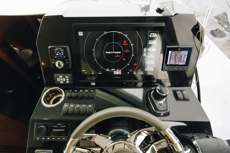 Slide: The Image of 2026 Beneteau Antares 11 Fly helm with advanced navigation and control systems. - 11