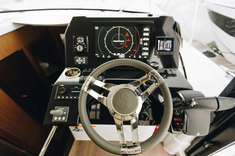 Slide: The Image of Steering console of 2026 Beneteau Antares 11 Fly with advanced navigation system. - 12
