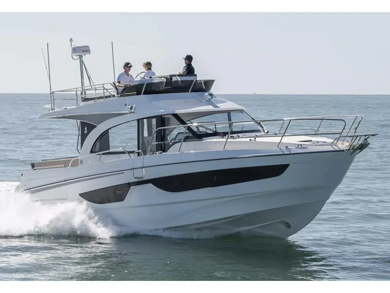 Slide: The Image of 2026 Beneteau Antares 11 Fly yacht docked at marina, side view. - 2