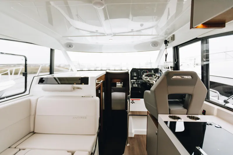 Slide: The Image of Interior of 2026 Beneteau Antares 11 Fly, featuring modern helm and seating area. - 9