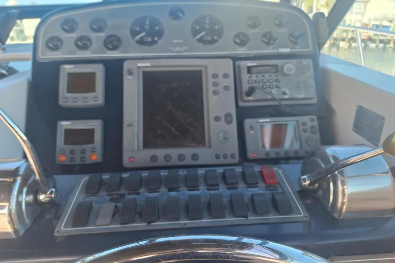 Slide: The Image of Control panel of a 2002 Tiara 3500 Open boat with navigation instruments. - 10