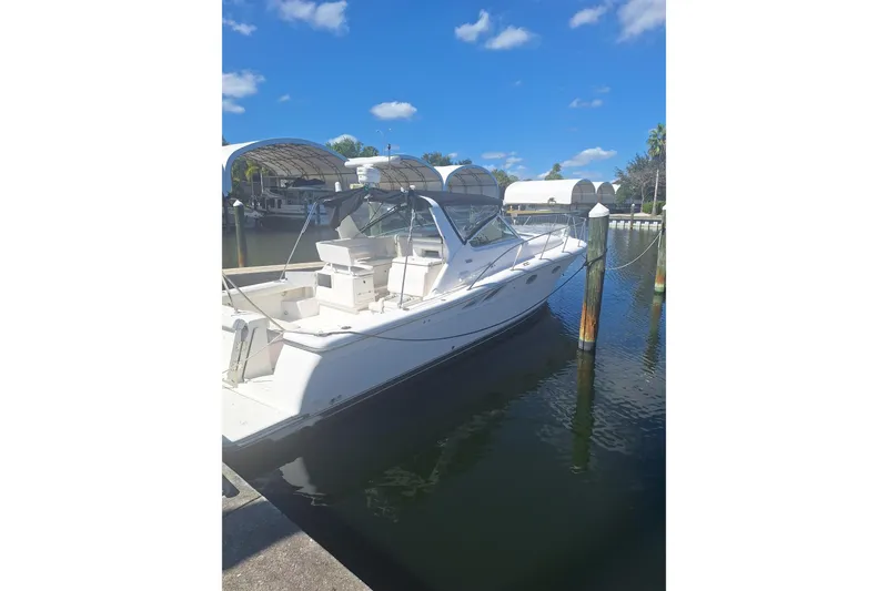 Slide: The Image of 2002 Tiara Yachts 3500 Open docked in a sunny marina. - 22