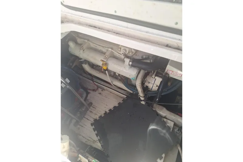 Slide: The Image of Engine compartment of a 2002 Tiara Yachts 3500 Open, showing mechanical components. - 26