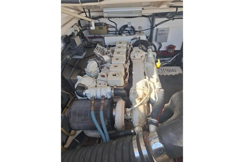 Slide: The Image of Engine compartment of a 2002 Tiara Yachts 3500 Open, showcasing mechanical components. - 28