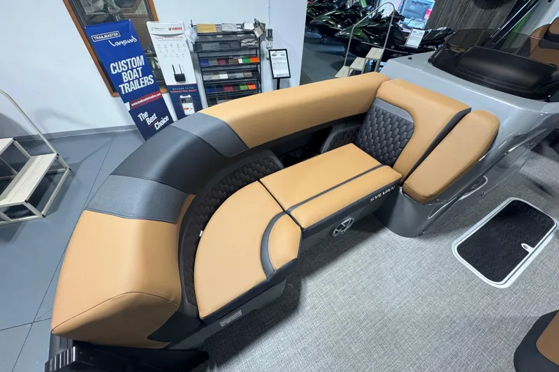 Slide: The Image of Luxurious seating on 2026 Sylvan L3 DLZ boat, featuring tan and black upholstery. - 11