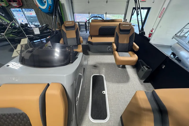 Slide: The Image of Interior of 2026 Sylvan L3 DLZ boat with tan and black seating. - 13