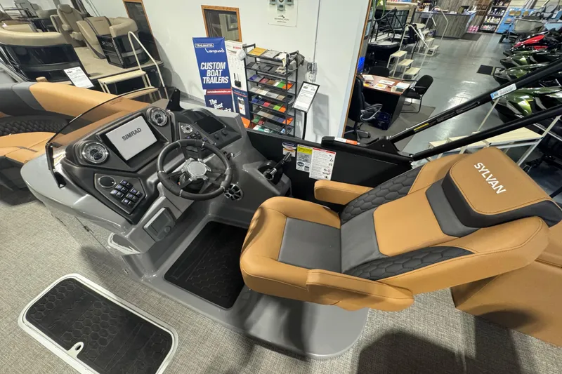 Slide: The Image of 2026 Sylvan L3 DLZ boat interior with steering console and luxurious seating. - 16