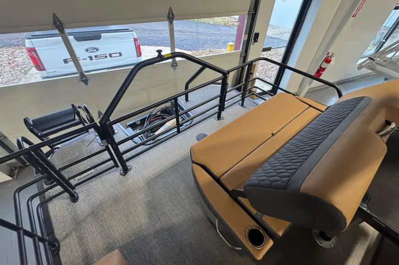 Slide: The Image of Interior of 2026 Sylvan L3 DLZ pontoon boat with tan seating and railing. - 22