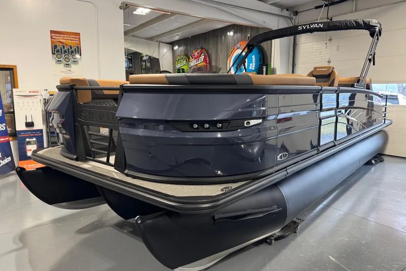 Slide: The Image of 2026 Sylvan L3 DLZ pontoon boat in showroom, featuring sleek design and modern amenities. - 3