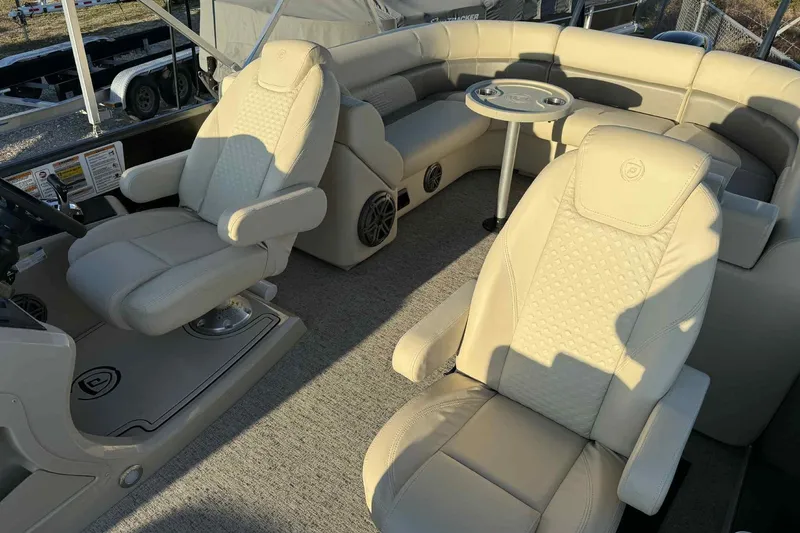 Slide: The Image of Luxurious interior of 2021 Premier 250 RE Sunsation LTD pontoon boat with plush seating. - 10