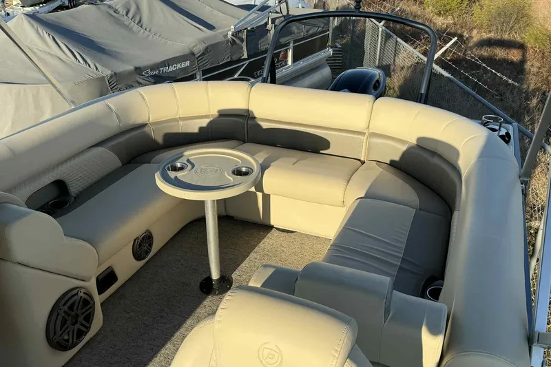 Slide: The Image of Luxurious seating area on a 2021 Premier 250 RE Sunsation LTD pontoon boat. - 11
