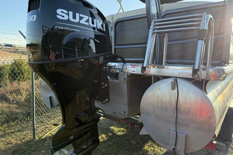 Slide: The Image of 2021 Premier 250 RE Sunsation LTD with Suzuki outboard motor and ladder. - 17