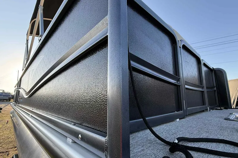 Slide: The Image of 2021 Premier 250 RE Sunsation LTD pontoon boat, close-up of sleek black exterior. - 18