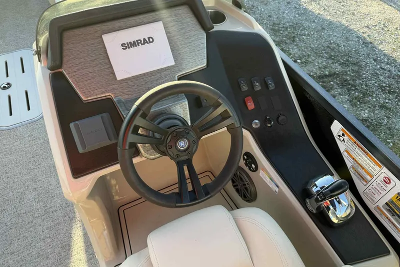 Slide: The Image of Steering console of 2021 Premier 250 RE Sunsation LTD with Simrad display. - 19