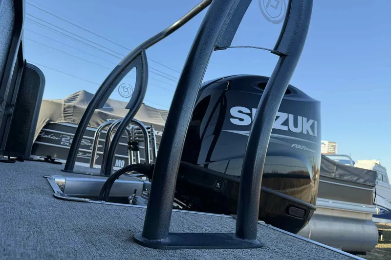 Slide: The Image of 2021 Premier 250 RE Sunsation LTD with Suzuki outboard motor, docked under clear sky. - 6